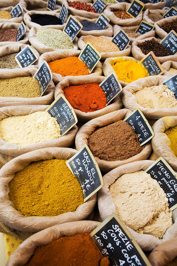 Italy, Emilia-Romagna, Ferrara, Close up of assorted spices in bags in market