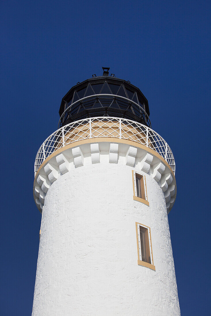 UK, Scotland, Dumfries and Galloway, Low angle view of lighthouse against blue sky