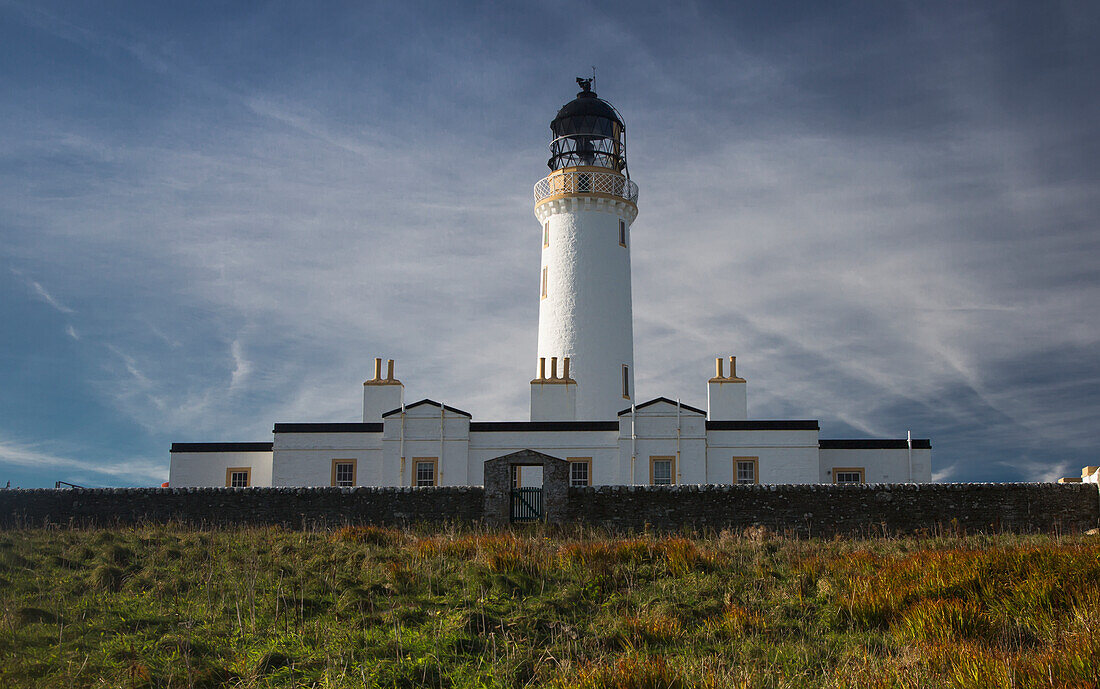 White lighthouse on coast; Dumfries and Galloway, Scotland, UK
