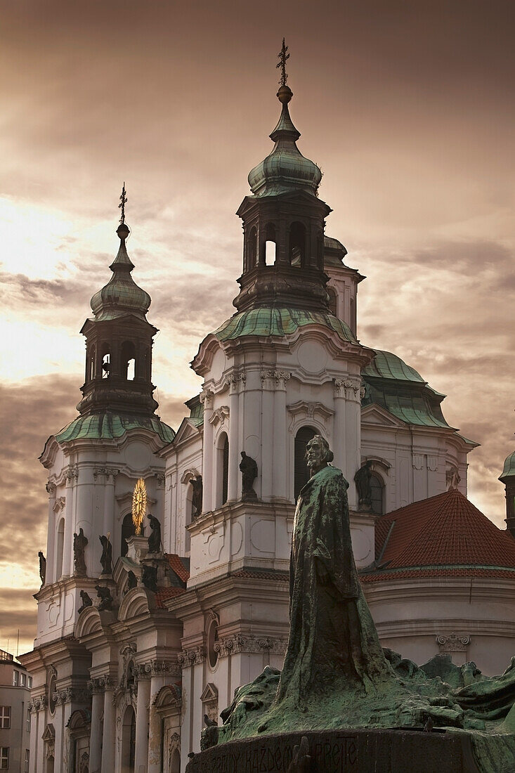 Czech Republic, Architecture and statue at sunset; Prague