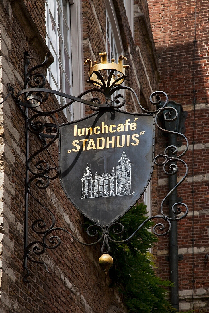 Netherlands, Zealand, Sign for restaurant mounted on brick building; Goes