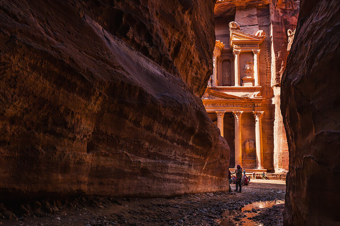 Jordan, El Khazneh seen from natural narrow canyon; Petra