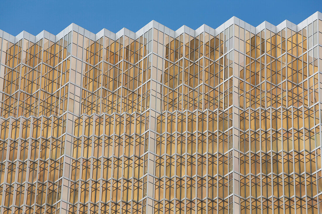 Close Up Of A Gold Glass Skyscraper And Blue Sky; Toronto, Ontario, Canada