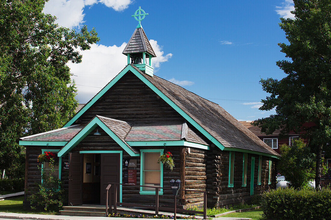 A Log Church With A Celtic Cross On The Steeple; Whitehorse, Yukon, Canada