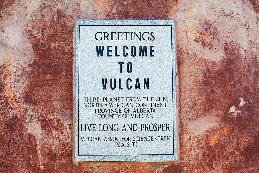 Sign On A Pedestal That Holds Vulcan's Starship Fx6-1995-A, Replica Of The Starship Enterprise From Gene Roddenberry's Star Trek; Vulcan, Alberta, Canada