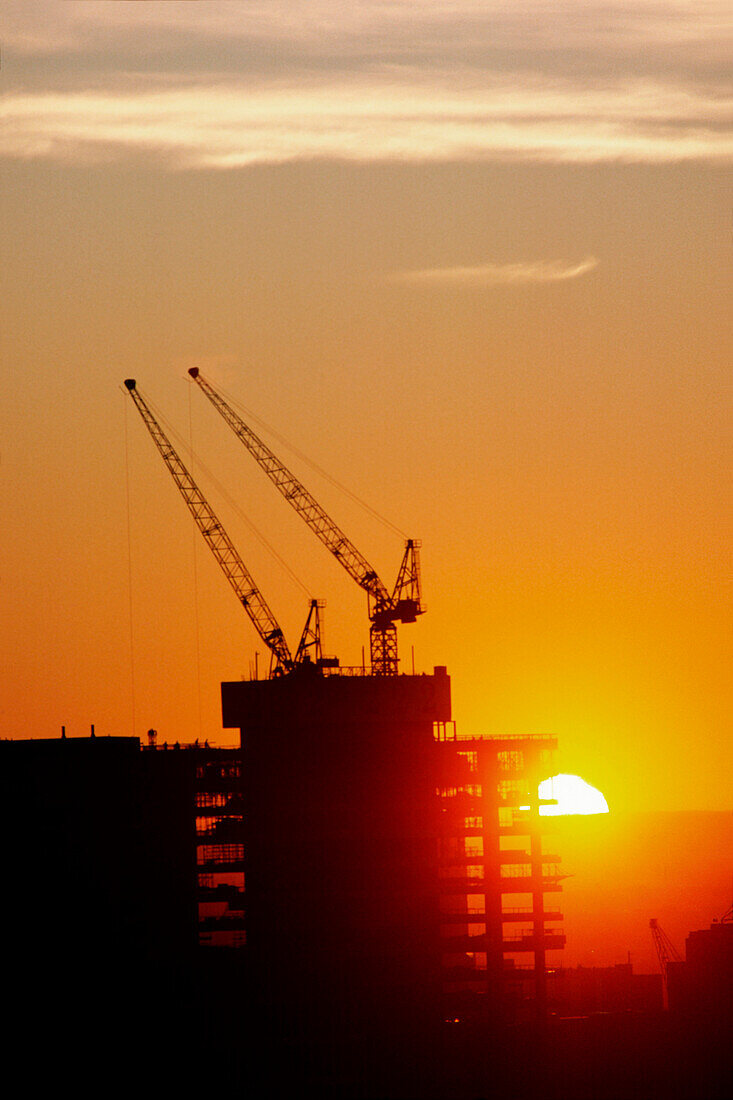 Office Building Construction Cranes, Sunset Silhouette