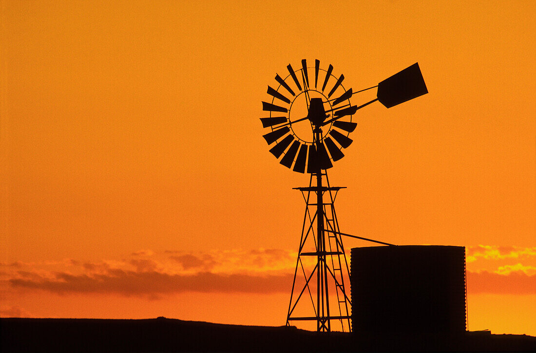 Windmill, Water Tank, Sunset Silhouette