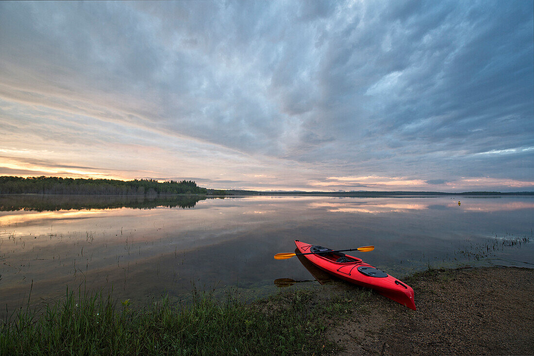 Kayak on Calm Lake, Saskatchewan, Canada