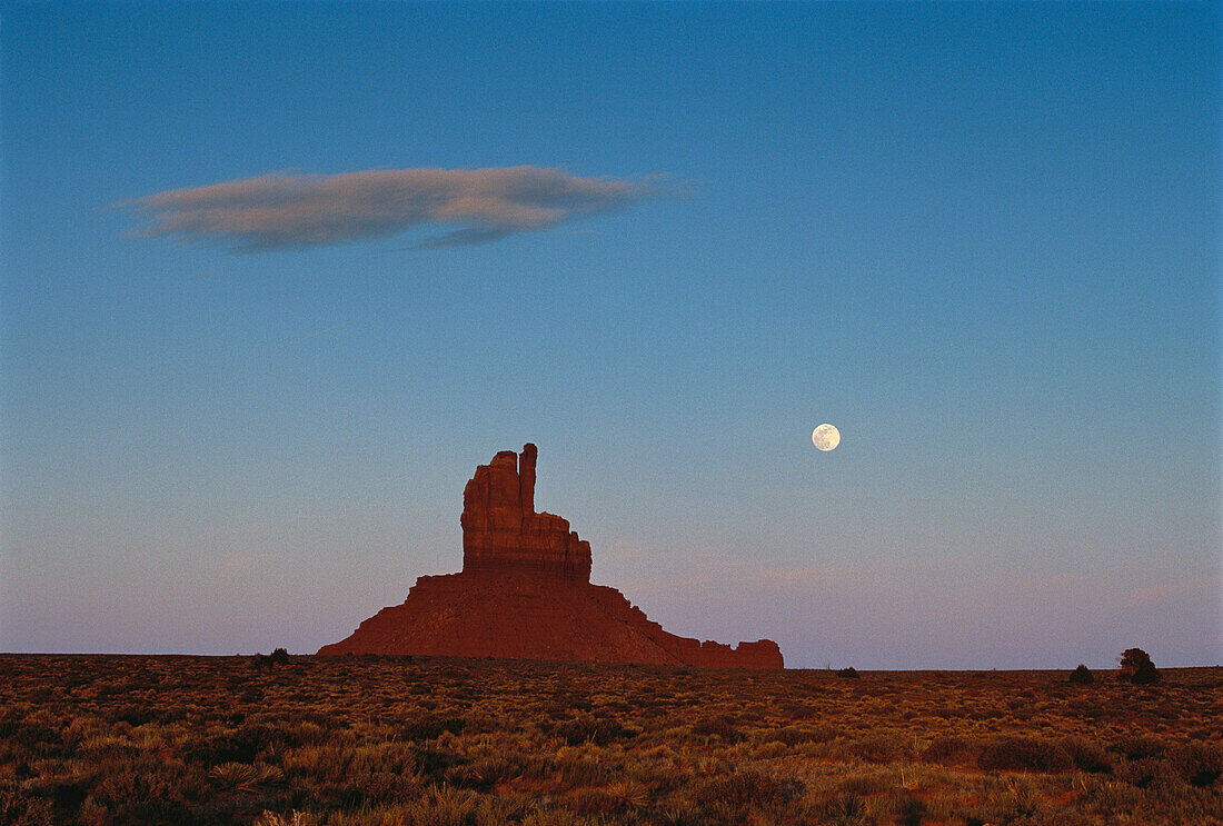 Overview of Rock Formation and Full Moon, Monument Valley, Arizona, USA