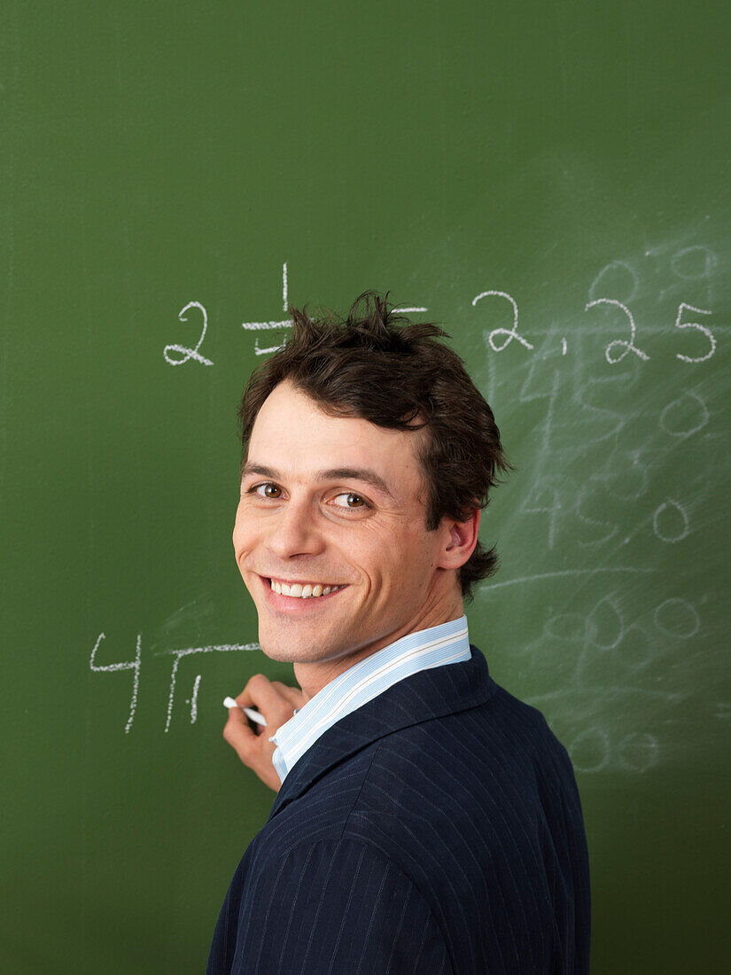 Teacher Writing on Blackboard