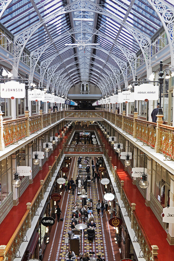 Overview of the Strand Arcade with glass vaulted ceiling and ornate brackets in Sydney, Australia