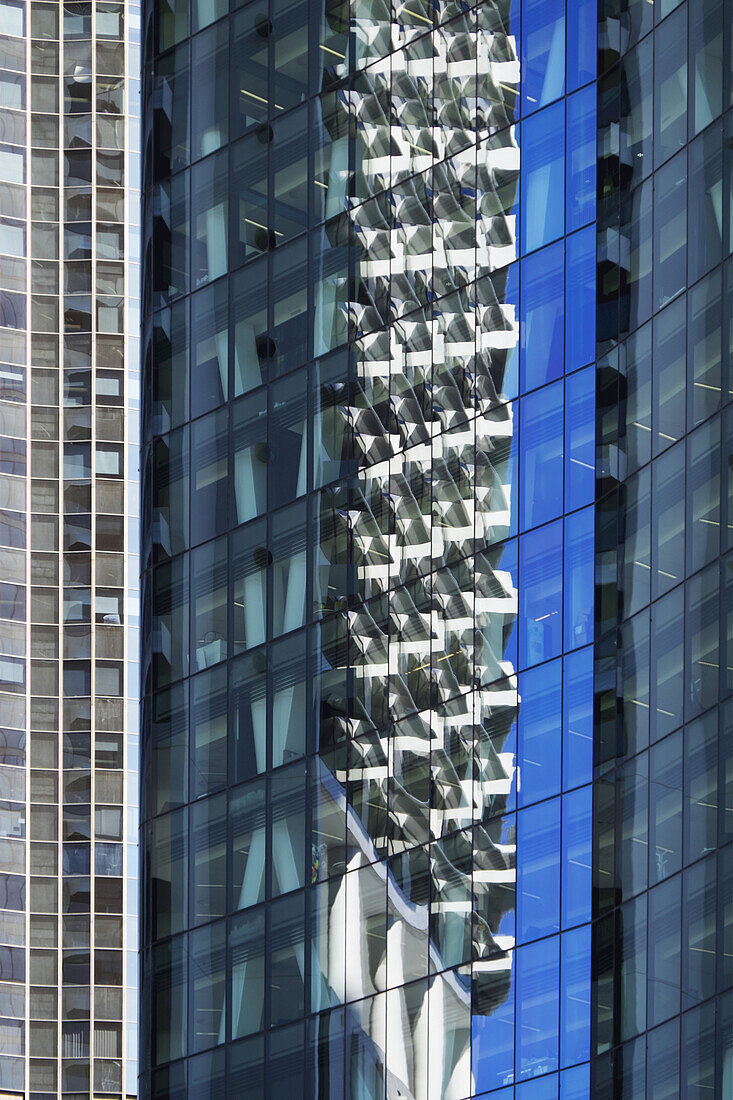 Close-up of reflections in glass windows of office buildings in Brisbane, Australia