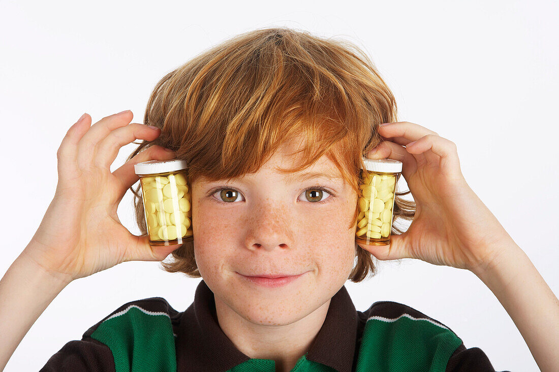 Boy Holding Pill Bottles