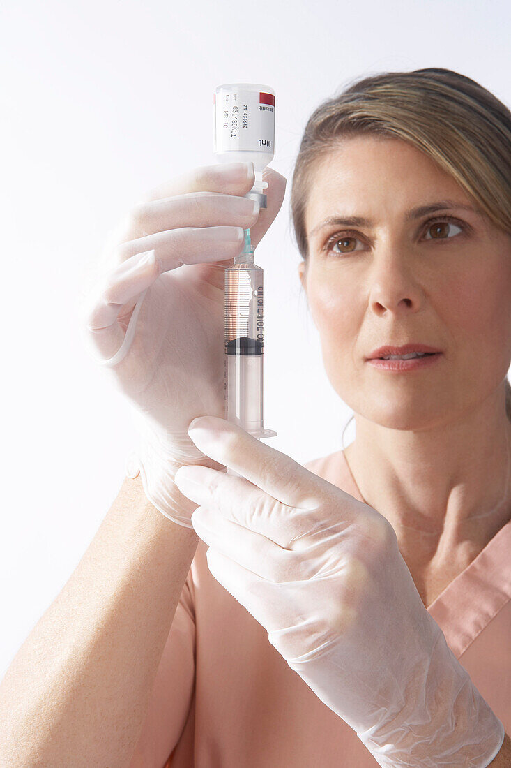 Nurse Preparing a Needle