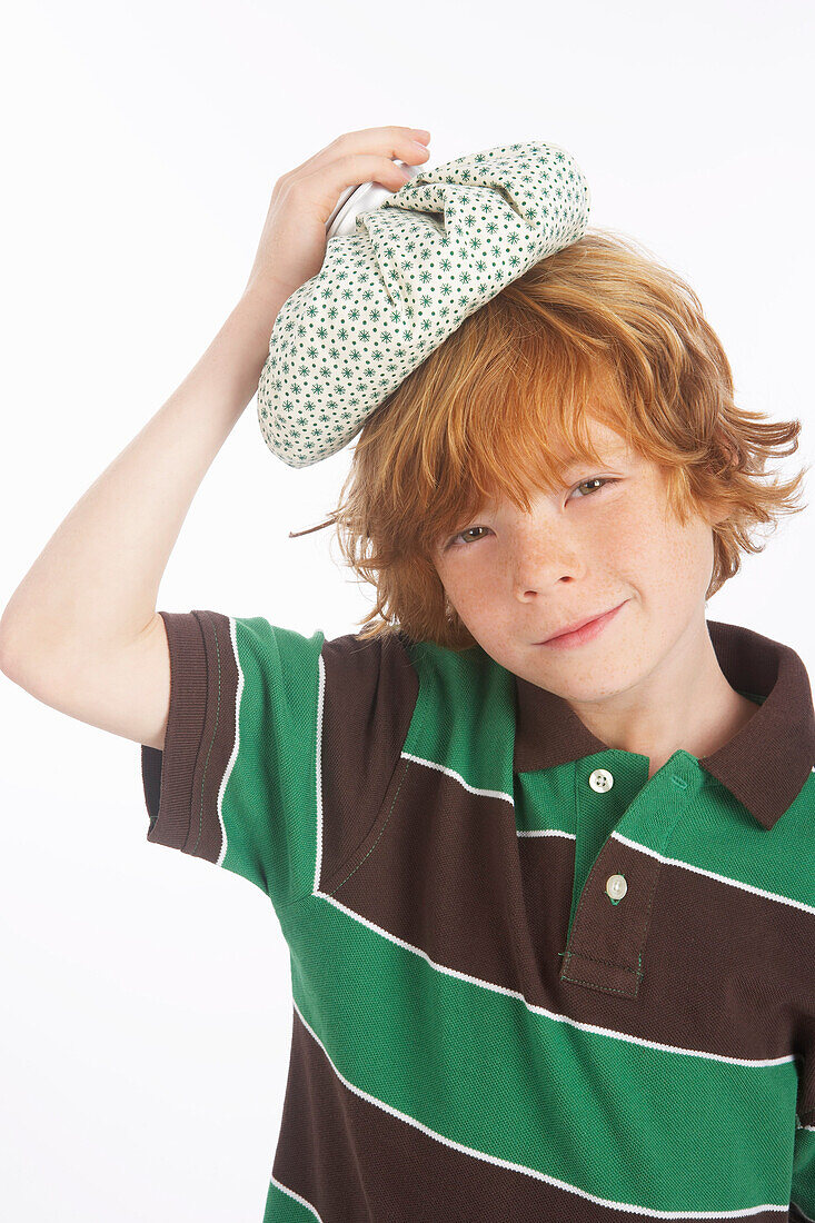 Boy Holding an Ice Pack on His Head