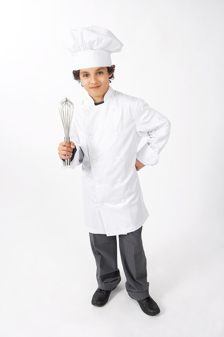Boy Dressed Up as a Chef Holding a Whisk