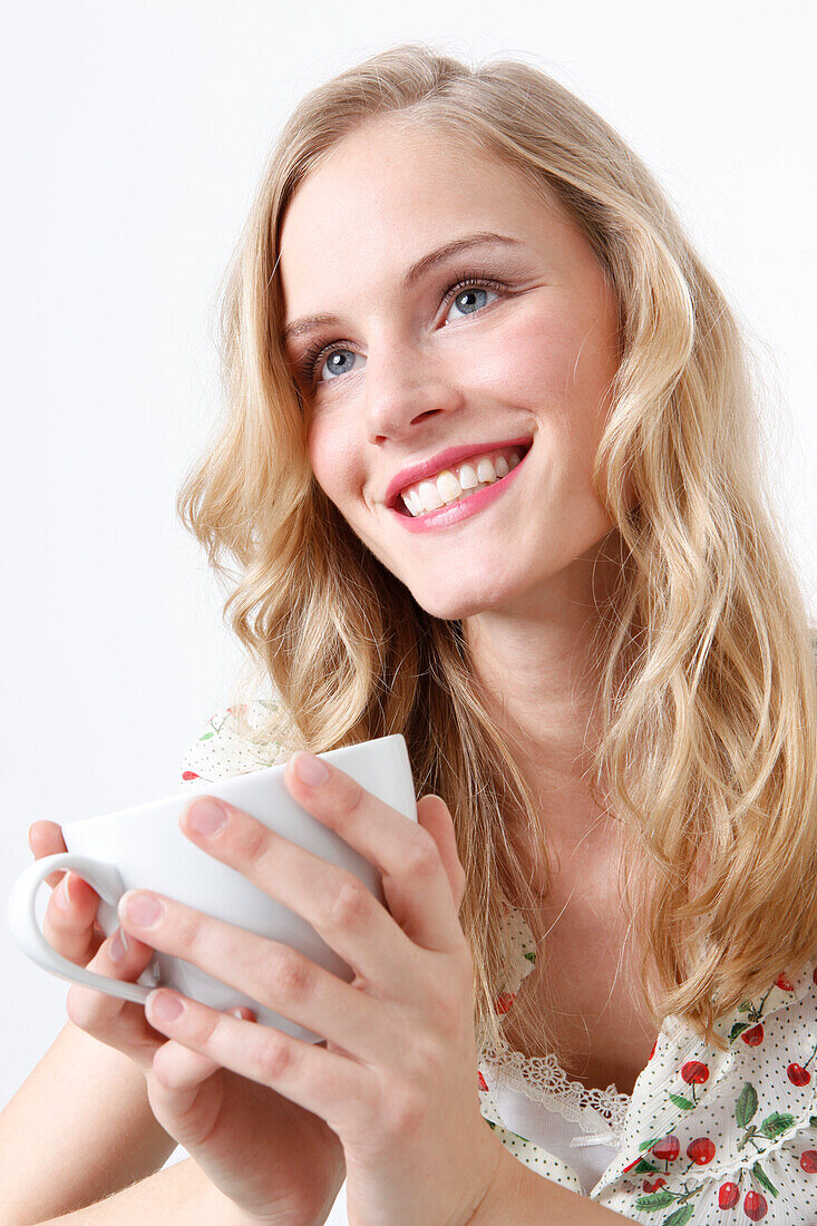 Woman Enjoying a Cup of Coffee