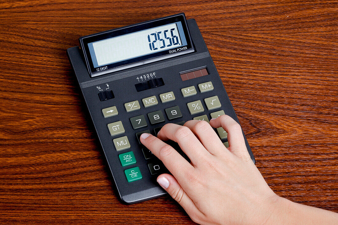 Woman Using Calculator