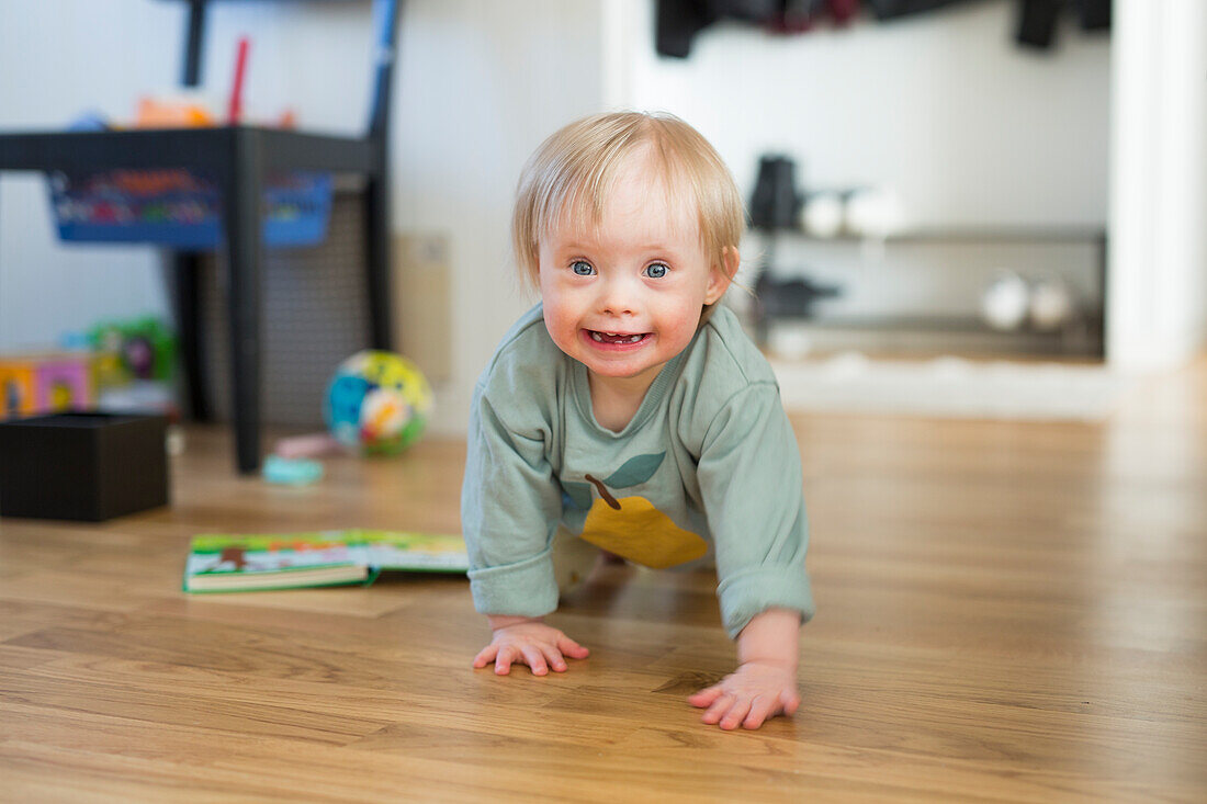 Toddler with down syndrome crawling