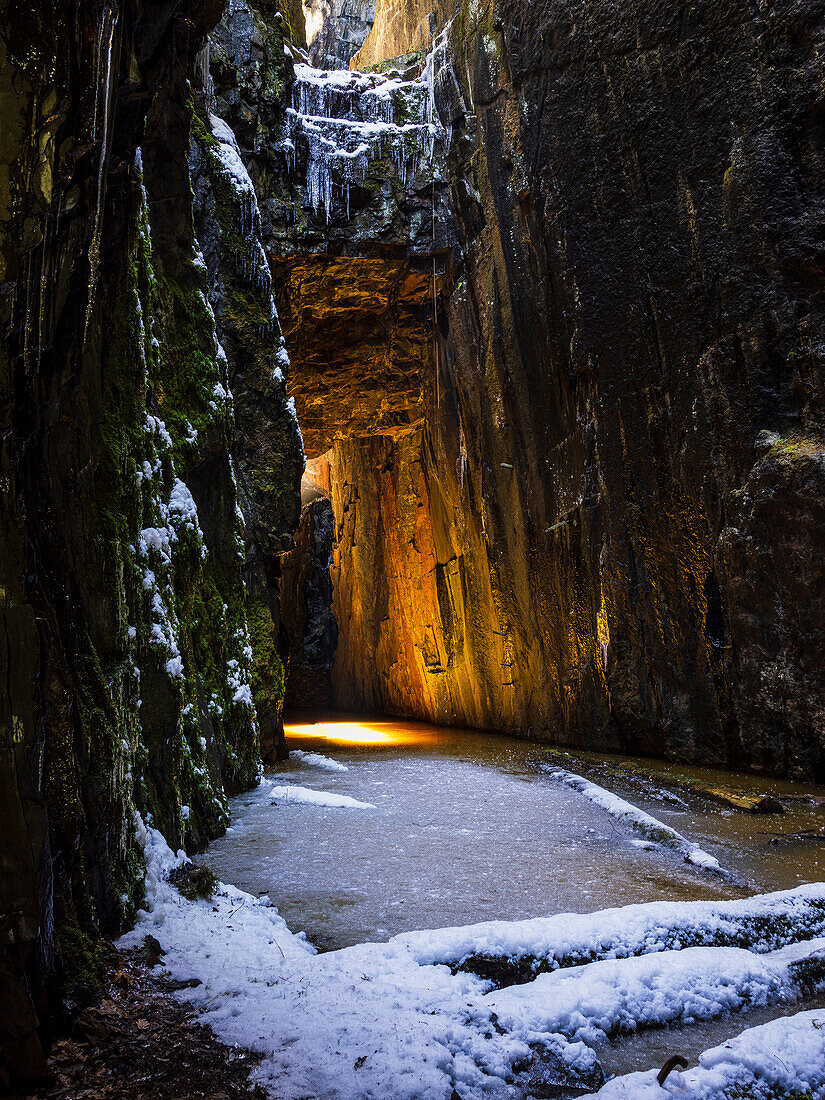 View of rock crevice at winter