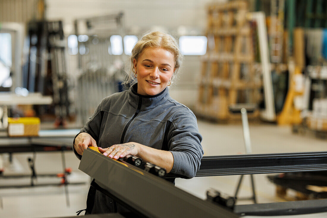 Young woman working in factory