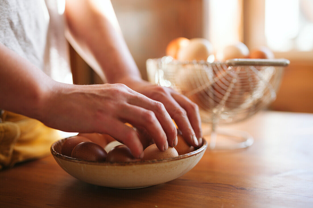 Woman's hands holding eggs preparing baking