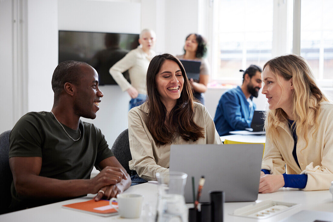 Group of business people discussing project in office