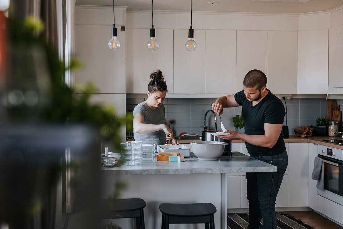 Couple doing healthy meal prep at home