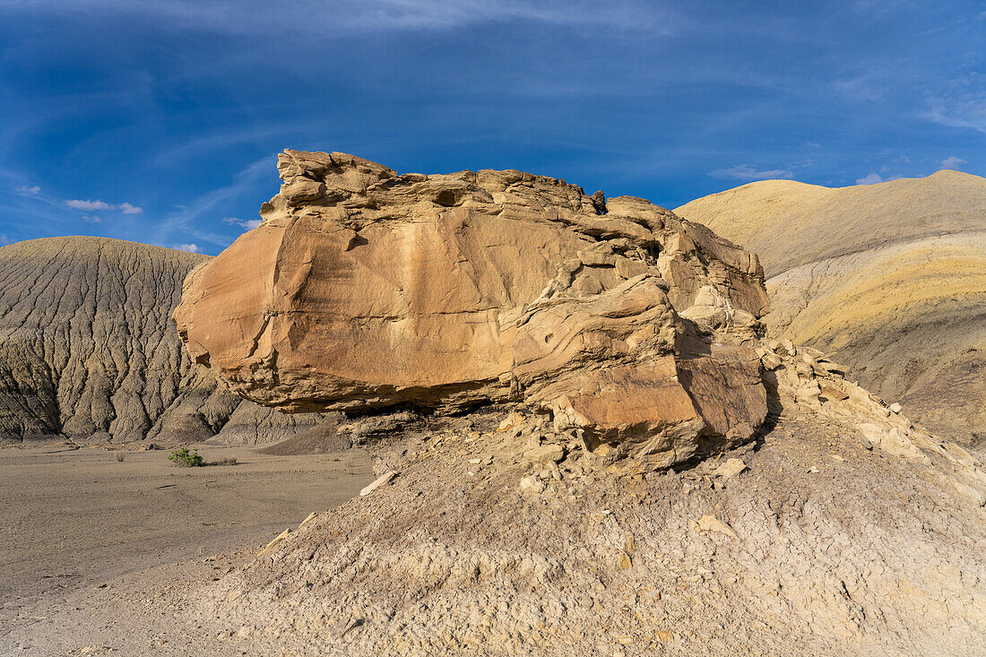 Colorful Mancos Shale formations with eroded sandstone boulders in the Blue Valley. Caineville Desert near Hanksville, Utah.