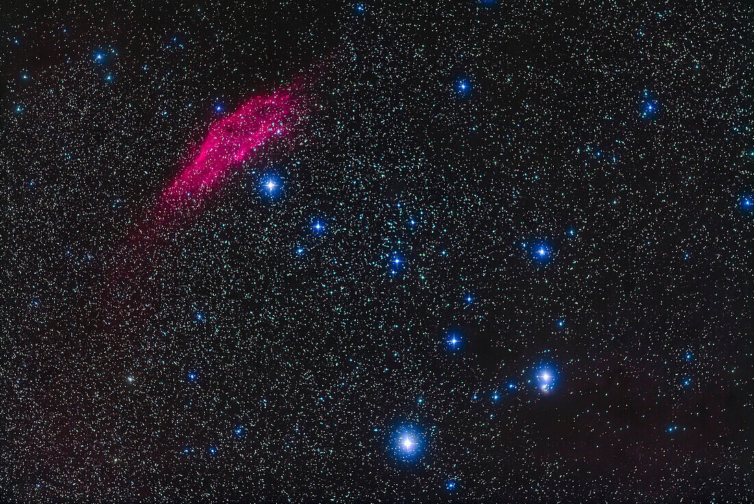 The California Nebula, NGC 1499, at top left, with the bright star Zeta Persei. at bottom A faint region of reflection nebulosity, IC 348, surrounds the star Atik, or Omicron Persei, at bottom right. The star just below NGC 1499 is Menkib, or Xi Persei. The field is similar to that of binoculars.