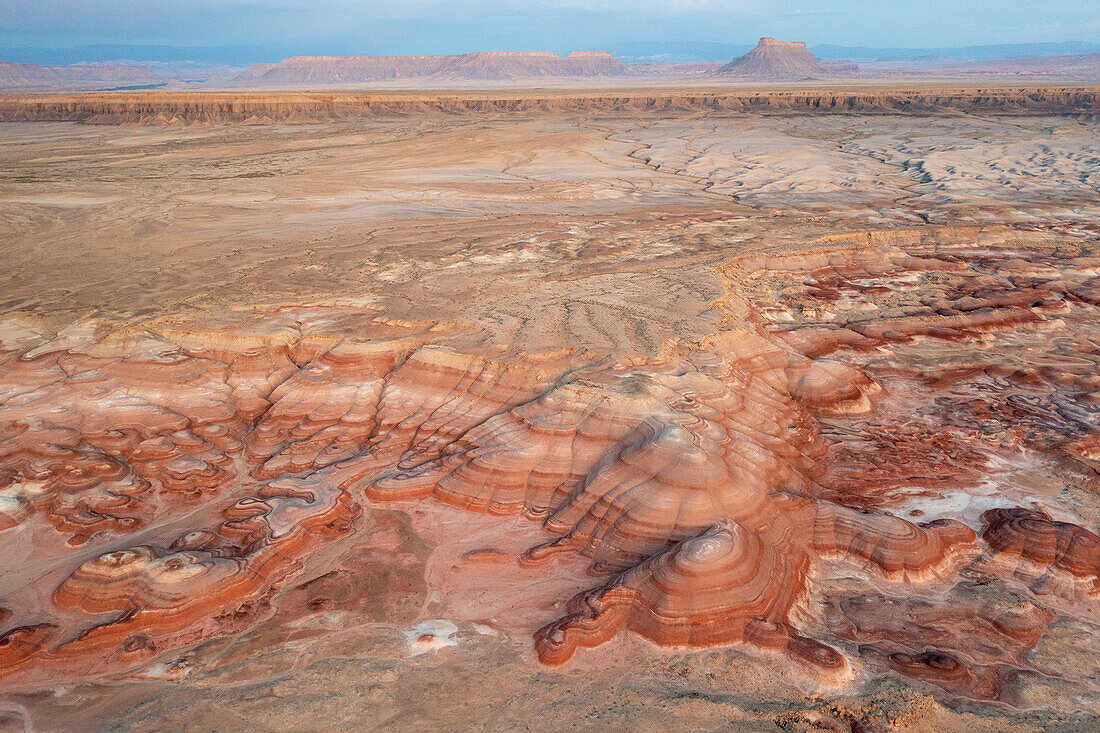 Aerial view of the colorful Bentonite Hills and Factory Butte before dawn, near Hanksville, Utah.