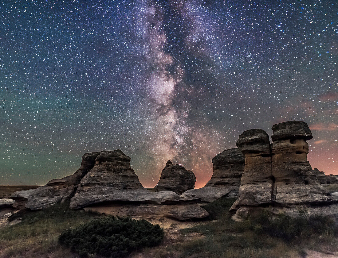 The summer Milky Way over the sandstone formations at Writing-on-Stone Provincial Park in southern Alberta, on a dark of the Moon night, July 31, 2016. The foreground is iluminated only by starlight. No artificial light painting was employed here. The Lagoon Nebula and objects in Sagittarius and Scutum are to the south here at centre.