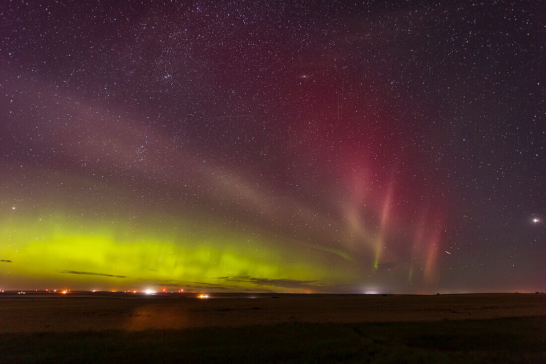 A Kp4-level aurora to the north with a STEVE arc to the east with traits of a red SAR arc as well. Taken from home as part of a time-lapse sequence, August 29, 2022, with the Canon R6 and Venus Optics Laowa 15mm lens at f/2 for 20 seconds at ISO 1600.