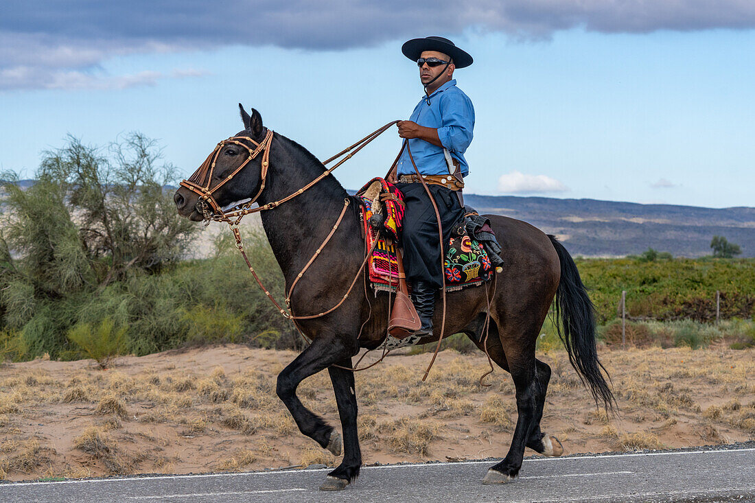 A horseman in gaucho regalia riding near San Juan, Argentina.