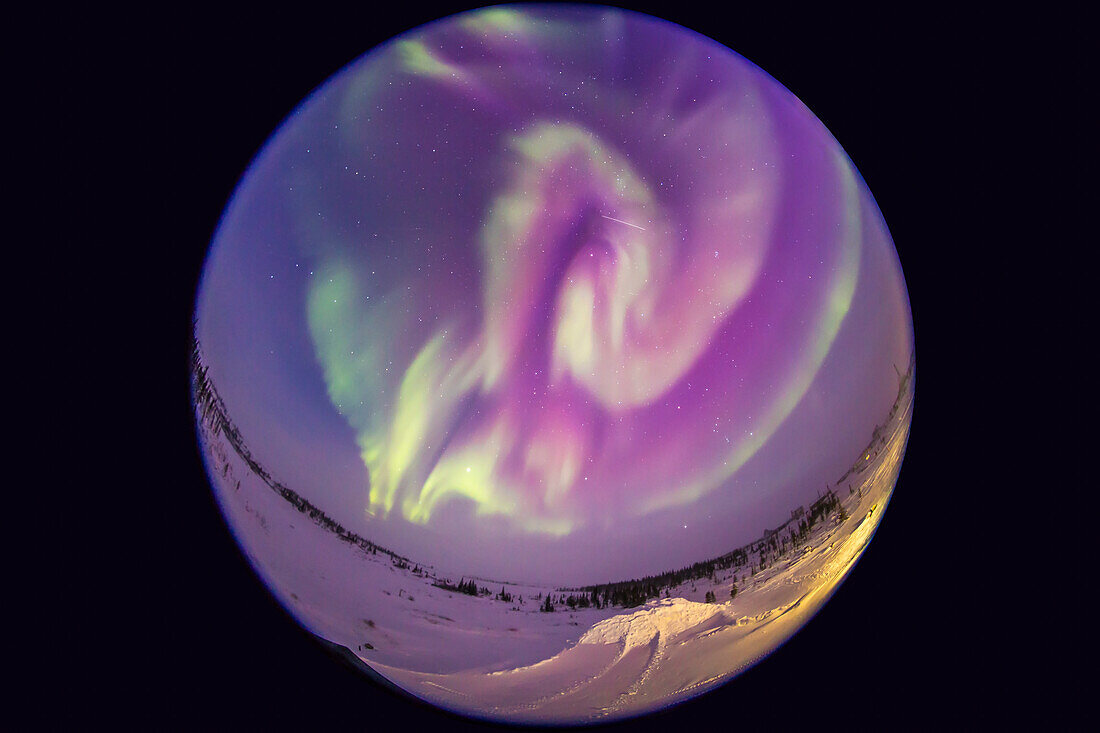 An all-sky aurora from Churchill, Manitoba, on Feb 17, 2015, in a frame from a 250-frame time-lapse movie. Taken from the Churchill Northern Studies Centre, using an 8mm Sigma fish-eye lens on the Canon 6D for a 360° view of the sky, though with the camera titled about 25° to create an image suitable for projection in a tilted-dome digital planetarium. This a 15-second exposure at ISO 3200 and f/3.5. The temperature was about -30° C.