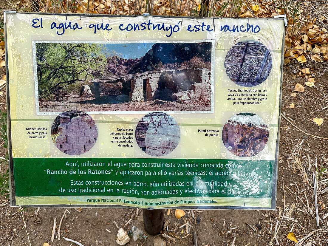 An informational sign about the former Estancia El Leoncito in El Leoncito National Park in Argentina.