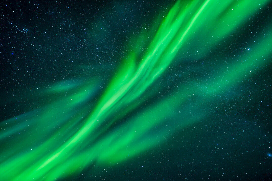Auroral curtains at the zenith, with shades of green and cyan, from the display of September 8, 2018 taken from the Tibbitt Lake site near Yellowknife, NWT.