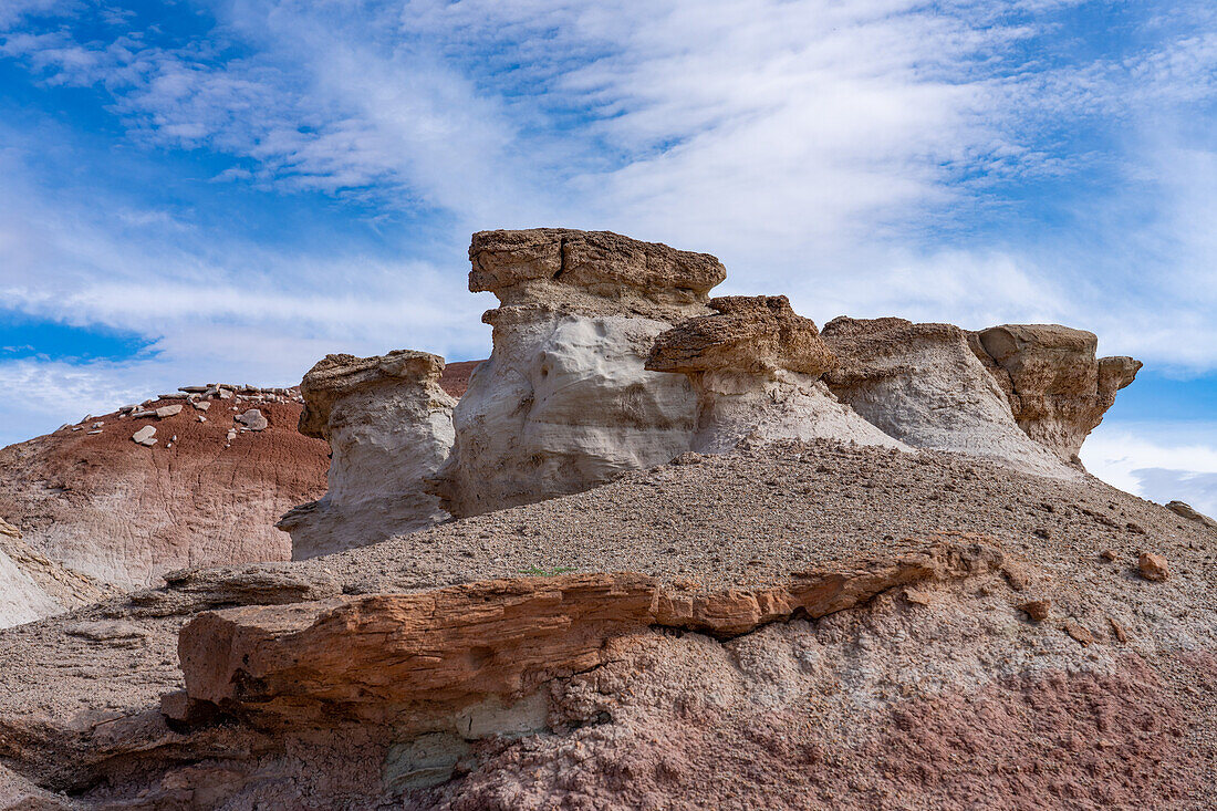 Stone caprocks on clay hoodoos in the bentonite hills of the Caineville Desert near Hanksville, Utah.