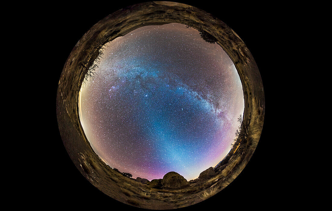 A 360° fish-eye panorama of the evening sky, January 16, 2015, showing the Zodiacal Light rising out of the western sky and last vestiges of twilight, and the Milky Way across the sky in the east. Comet Lovejoy (C/2-14 Q2) near the Pleiades just left of centre at the top of the pyramid of light from the Zodiacal Light. A meteor appears below centre. This is a stitch of 8 segments, each taken with the 15mm lens and Canon 6D in portrait orientation, for 1 minute at ISO 3200 and f/2.8. Stitched with PTGui.