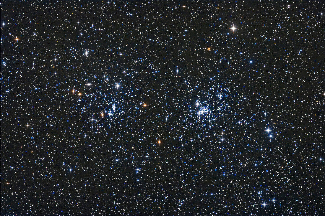 Double Cluster in Perseus, taken Oct 14, 2007 with 5-inch apo refractor at f/6 with Canon 20Da at ISO 800 for stack of 4 x 8 minute exposures. Some haze. Used ST402 guider.
