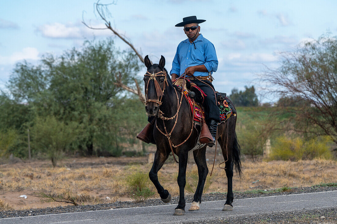 A horseman in gaucho regalia riding near San Juan, Argentina.