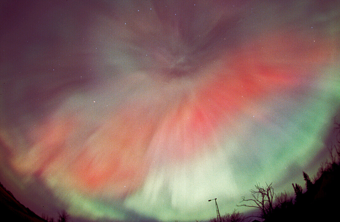 April 17/18, 2001 aurora, taken from home in Alberta. looking south. Part of a series taken looking same direction as substorm hit and subsided, from Image #2 to #15, on Roll #1. (Roll #2 was second camera shooting Provia 100F with 28mm lens and 18mm lens.) All images in this series (#1-02 thru 15) processed in Photoshop with nearly identical enhancements to contrast and colour. Brightness toned down for longer overexposed shots (early ones).