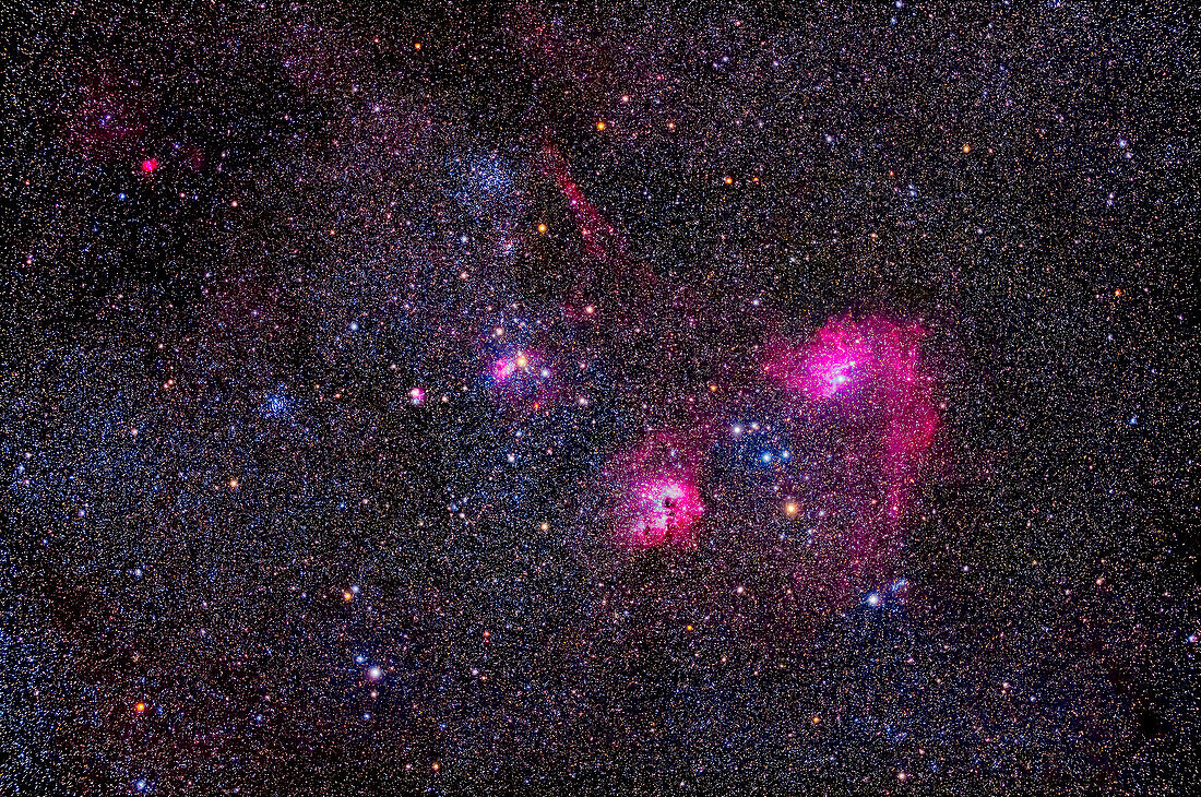 This is a framing of the rich array of star clusters and nebulas in central Auriga. The large star cluster Messier 38 is at top left, with the small cluster NGC 1907 just below it. The smaller star cluster Messier 36 is at left. M38 is often called the Starfish Cluster, while M36 is the Pinwheel Cluster.