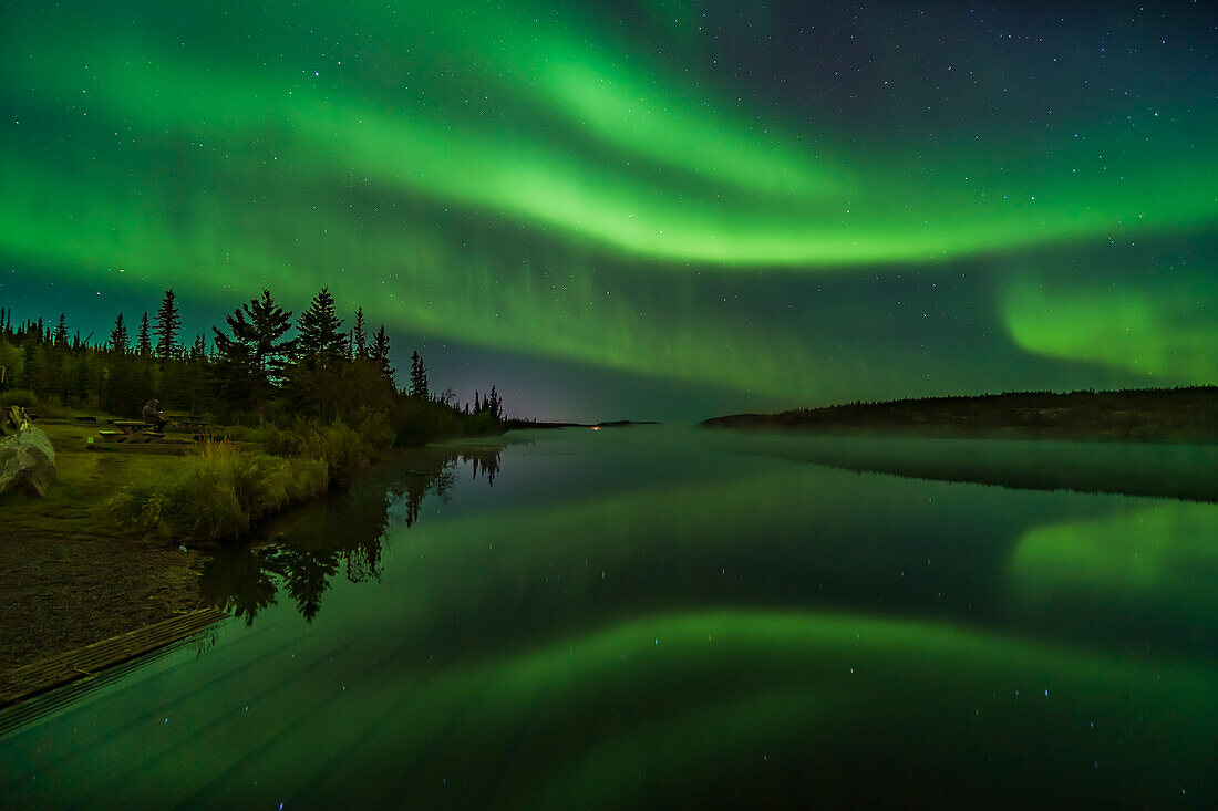 Reflections of the Northern Lights in the calm and misty waters of Madeline Lake on the Ingraham Trail near Yellowknife, NWT on Sept 7, 2019. This is one of a series of “reflection” images. Altair is at left.