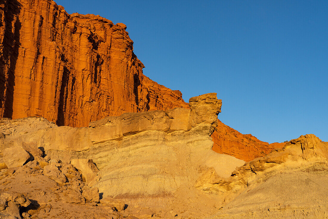 Colorful red sandstone cliffs at sunset in Ischigualasto Provincial Park, San Juan Province, Argentina.