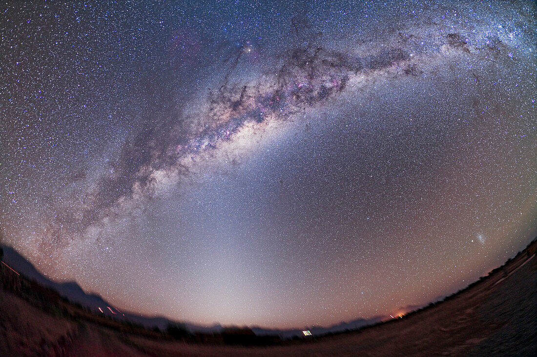 Southern Milky Way from Atacama Lodge, Chile (latitude 23° S) taken March 14/15, 2010. Taken witn Canon 5D MkII (modified) and Canon 15mm lens at f/4 for stack of 4 x 6 minute exposures at ISO 800. Horizon retained from just one image to retain detail and minimize blurring from tracking. But sky is Mean stack. Taken before dawn with zodiacal light becoming promiment in east.