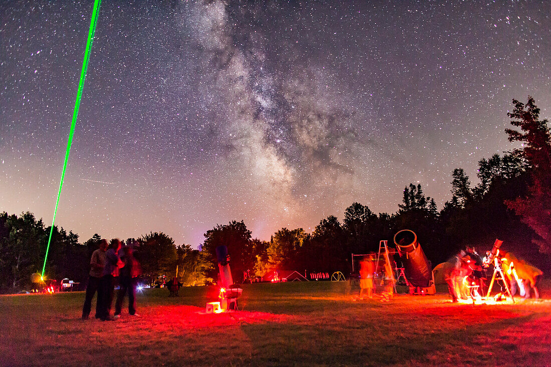 A scene at the Nova East Star Party near Windsor, Nova Scotia, in August 2015, showing laser pointer in use under a clear starry sky.