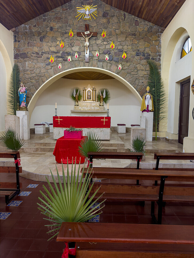 The small Catholic church of Nuestra Señora del Rosario y San Agustin in Villa San Agustin, Argentina, decorated for Palm Sunday.