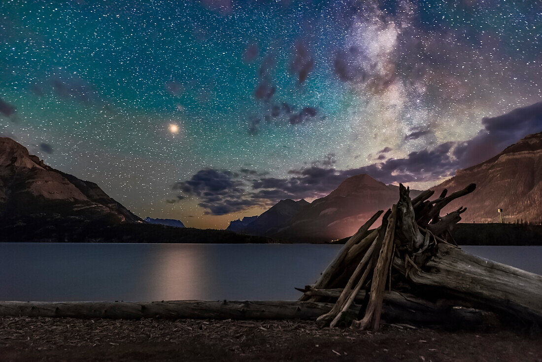 Bright yellow Mars approaching a close opposition in July 2018 shines over the waters of Middle Waterton Lake in Waterton Lakes National Park in southwest Alberta on the Alberta-Montana border. Mars is so bright it produces a glitter path on the water.