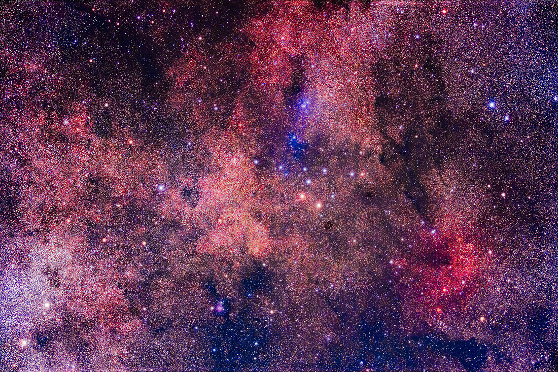 The colourful region in and around the Coathanger asterism in Vulpecula the Fox. The grouping is not a star cluster per se, though it is catalogued as one, Collinder 399. It is also known as Brocchi's Cluster. A true star cluster, NGC 6802, is located at the east (left) end of the Coathanger, as the small clump of stars. The area is also rich in faint nebulosity, notably: the Sharpless 2-83 reflection nebula complex above the Coathanger, and the small, round Sharpless 2-82 emission and reflection nebula below the Coathanger. The large area of red emission nebula at bottom right is not catalogu